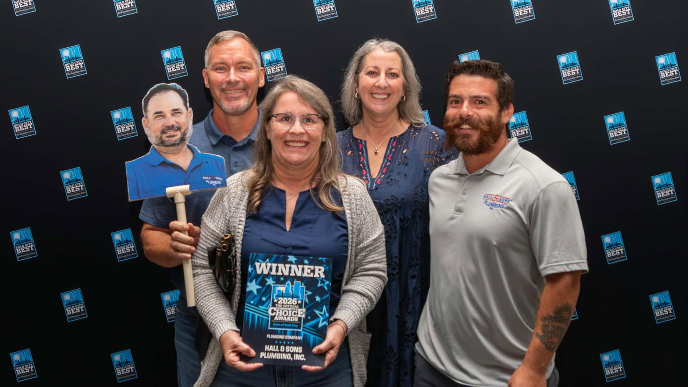 the team of hall & sons accepting their award at the Bold City Best Community Choice Awards
